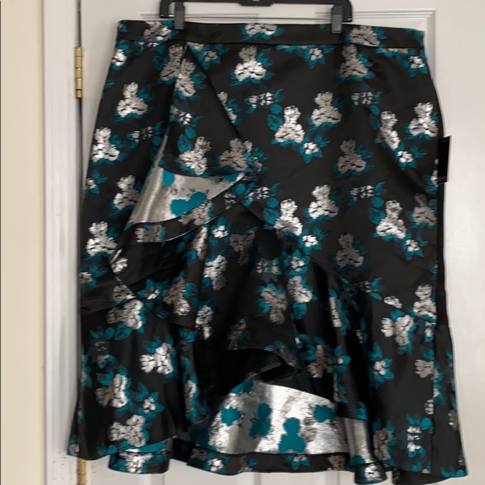 Silver, black and emerald high low & flared.